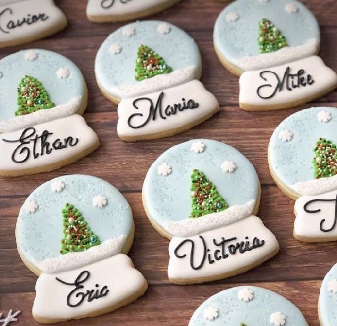 decorated cookies with names and trees on them