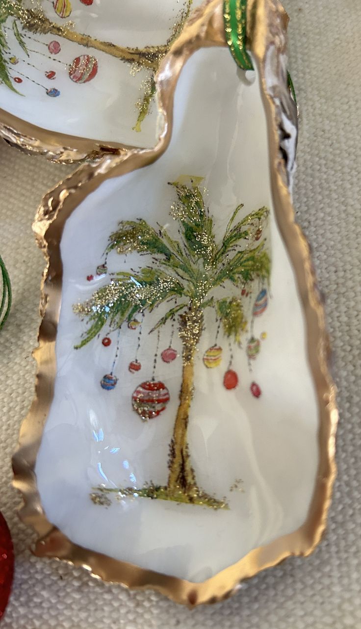 two decorative trays with palm trees on them