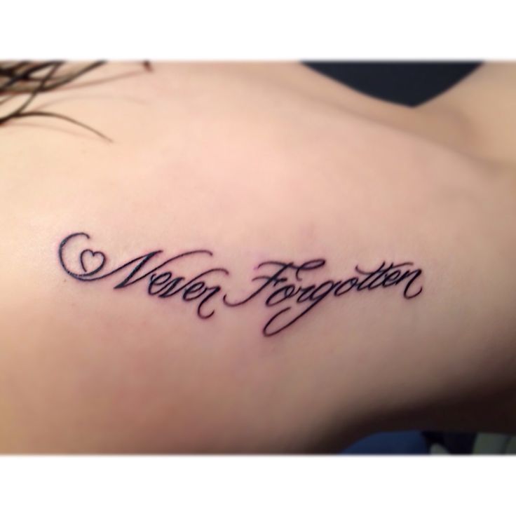 a woman with a tattoo on her shoulder that says, men together and hearts in cursive writing