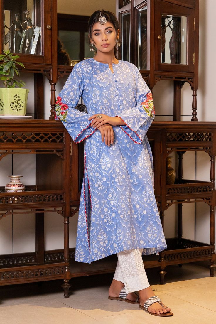 Sky blue cotton floral block print kurta. Paired with dyed embroidered worked dupatta and self print pant.
Component: 3
Pattern: Embroidered, Printed
Type Of Work: Magji lace, Block print
Neckline: Round notched
Sleeve Type: Flared sleeves
Fabric: Cotton, Doriya
Color: Blue
Other Details: 
Hand block prints
Doriya dupatta
Magji lace detail
Occasion: Work, Mehendi and Haldi - Aza Fashions Print Pant, Kurta Set For Women, Hand Block Print, Kurta Set, Printed Pants, Set For Women, Flared Sleeves, Aza Fashion, Fabric Cotton