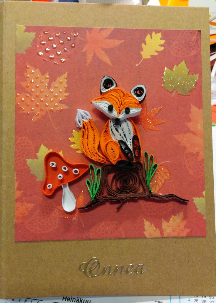 a card with an image of a fox sitting on a tree branch and mushrooms in the background