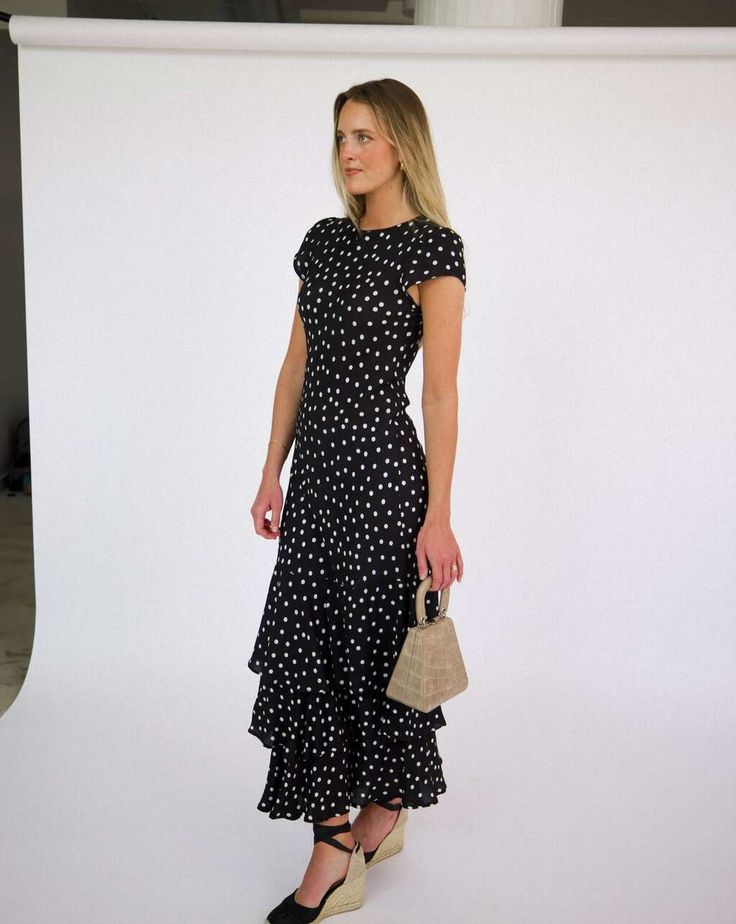 The Carmen is our new party silhouette. Adorned with classic polka dots, and a cascading tiered ruffle skirt. Ideal for garden parties, elegant dinners, or special occasions THE CUT Soft flutter sleeves Bias-cut and unlined for the best drape Viscose crepe Dry Clean Elegant Polka Dot Dress With Ruffles, Polka Dot Ruffled Evening Dress, Polka Dot Ruffle Dress For Evening, Polka Dot Ruffled Dress For Evening, Polka Dot Party Dress With Ruffle Hem, Polka Dot Dress With Ruffle Hem For Party, Polka Dot Tiered Dress With Ruffles, Tiered Polka Dot Dress With Ruffles, Tiered Ruffle Skirt