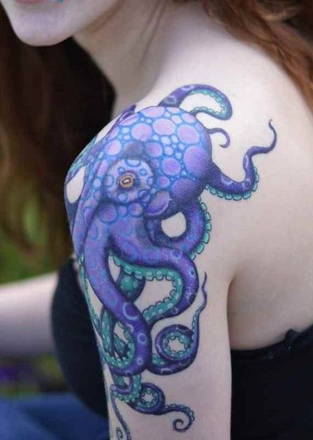 a woman with an octopus tattoo on her arm