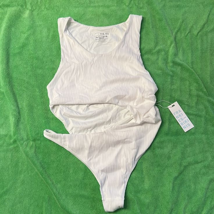 White Beautiful Cutout Suit. Never Worn, New W Tags Chic Sleeveless Bodysuit For Sunbathing, One-piece Beachwear Top For Poolside, Sleeveless Seamless Bodysuit For Beach, Seamless Sleeveless Bodysuit For The Beach, White Fitted Tank Bodysuit, Fitted White Tank Bodysuit, One-piece Stretch Tops For Swimming, Stretch Sleeveless Bodysuit For Sunbathing, Summer Beachwear Tops With Scoop Neck