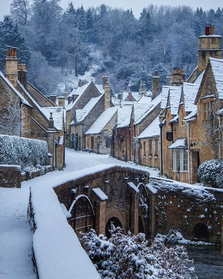 a river running through a snow covered village