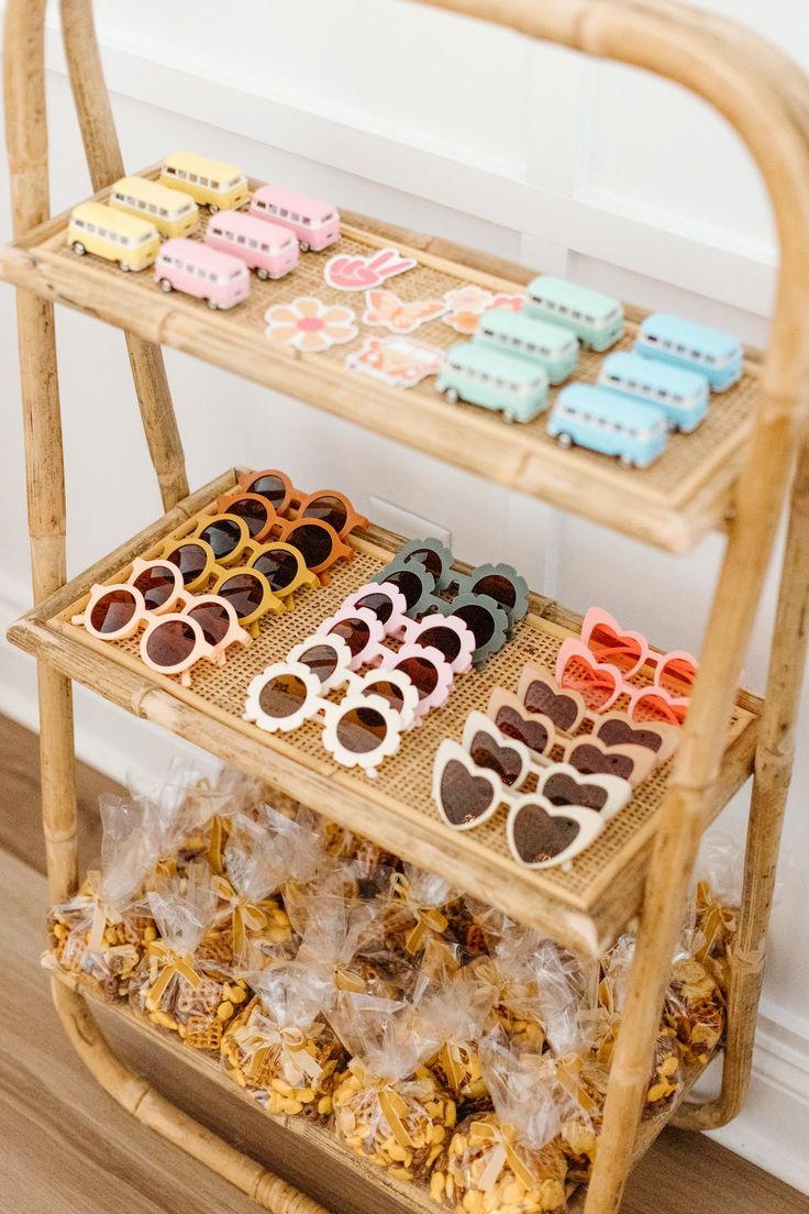 three tiered bamboo rack with sunglasses and candies