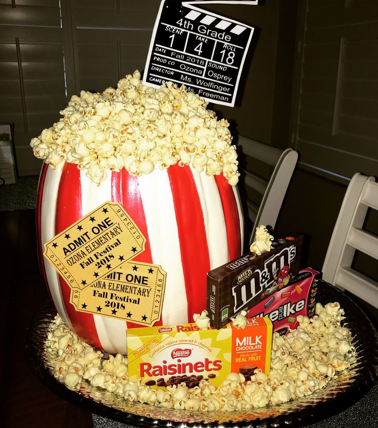 a large popcorn bucket with some signs on it