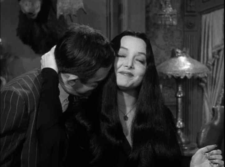 a man kissing a woman on the cheek in a scene from the film, dracula