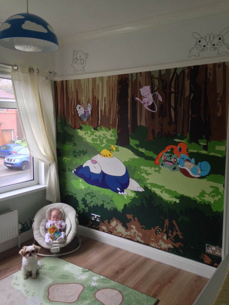 a child's room with a mural on the wall