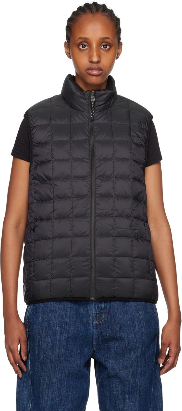 Reversible down-filled quilted nylon ripstop vest. Reverse in black sherpa fleece. Cotton-blend twill trim throughout. · Stand collar · Zip closure · Zip pockets · Elasticized hem and armscyes · Logo patch at interior chest · Zip pockets at interior Supplier color: Black/Black Fill: 95% down, 5% feather. Satin Trousers, Satin Jackets, White Ducks, Down Vest, Satin Skirt, Black Quilt, Sherpa Fleece, Sport Shorts, Stand Collar