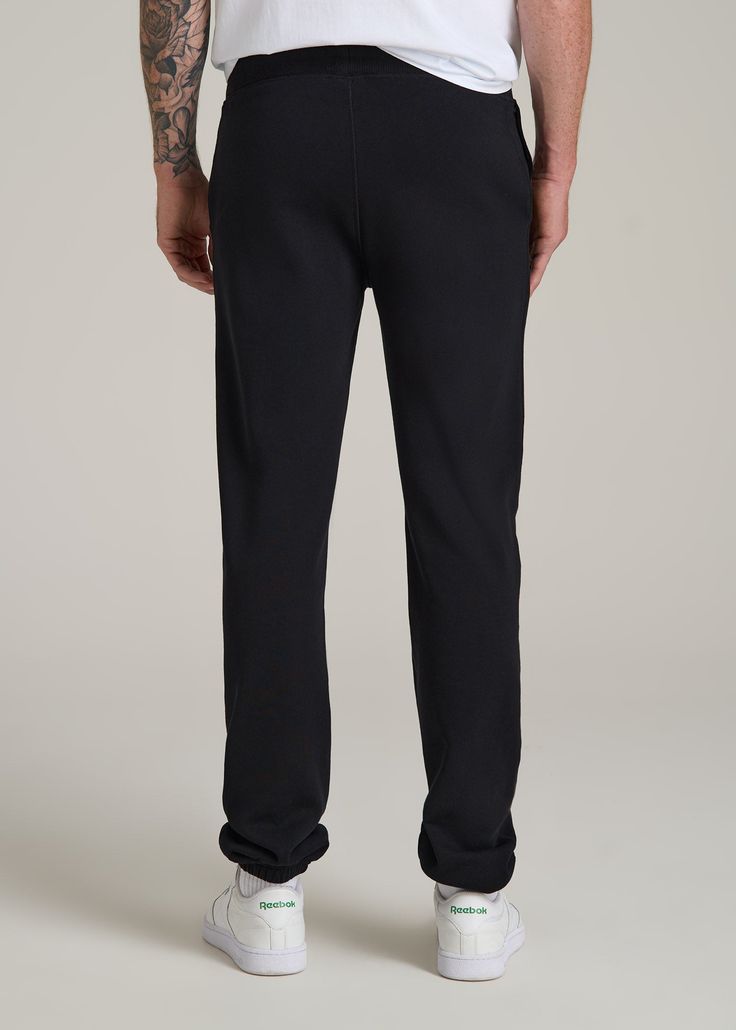 The Ultimate Fleece Sweatpants for Tall Men Relax, You’re Covered Introducing the Wearever 2.0 Fleece Sweatpants—because tall guys deserve the best chill pants too! These aren’t just any tall men's sweatpants; they’re your new go-to for everything from Netflix marathons to casual Fridays. With a new and improved waistband and stylish woven drawcords, you get the comfort you crave with the style you need. Plus, the soft fleece of these men's extra-long sweatpants keeps you warm while the stretch Black Fleece Sweatpants With Ribbed Waistband, Black Fleece Bottoms With Pockets, Black Fleece Bottoms With Ribbed Cuffs, Black Fleece Bottoms With Ribbed Waistband, Black Sweatpants With Pockets And Straight Hem, Black Relaxed Fit Sweatpants With Double-needle Hem, Black Sweatpants With Side Pockets And Straight Hem, Black Sweatpants With Side Pockets, Black Sweatpants With Ribbed Waistband And Straight Hem