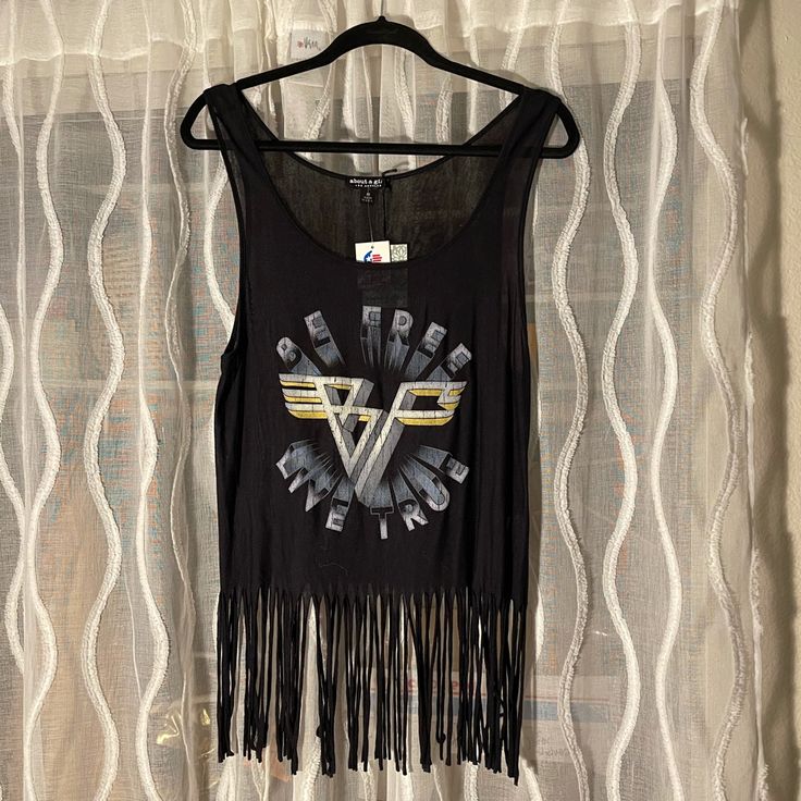 A Brand New Tank Top Very Cute With Black Fring. Reads “Be Free, Live True” In A Van Halen Look Logo. Never Worn. Trendy Black Top With Fringe, Trendy Black Fringe Top, Casual Black Fringe Tops, Trendy Black Tank Top For Festival, Casual Fringe Tops For Night Out, Trendy Black Tank Top For Music Festival, Black Tops For Music Festival In Spring, Black Top For Spring Music Festival, Black Fringe Tops For Summer