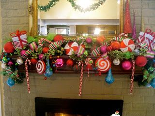 a fireplace decorated for christmas with candy canes and ornaments