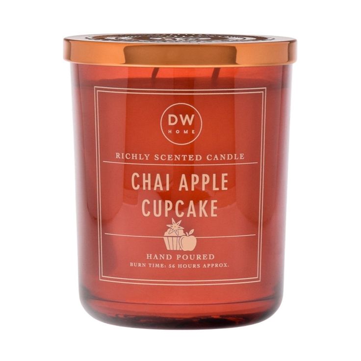 a red candle with an orange label that says chai apple cupcake on it