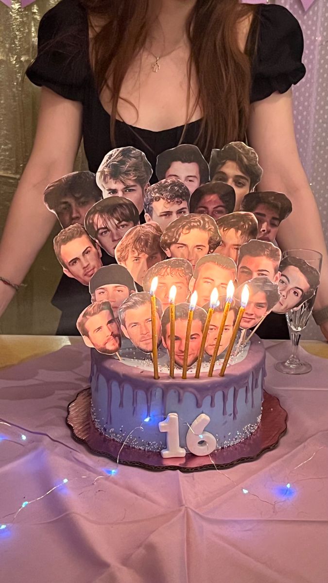 a birthday cake with candles and pictures on it