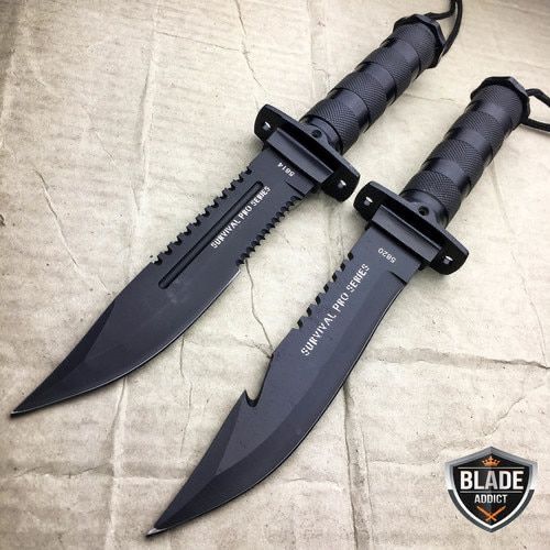 two knives with black handles are laying on the ground