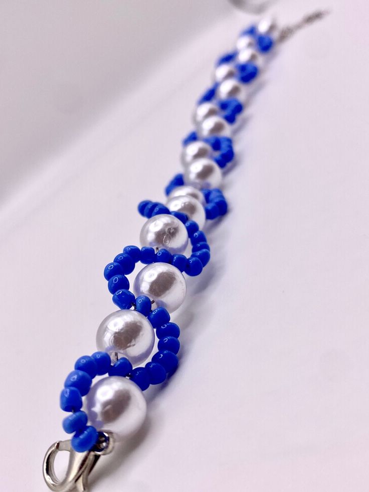 a blue and white beaded key chain