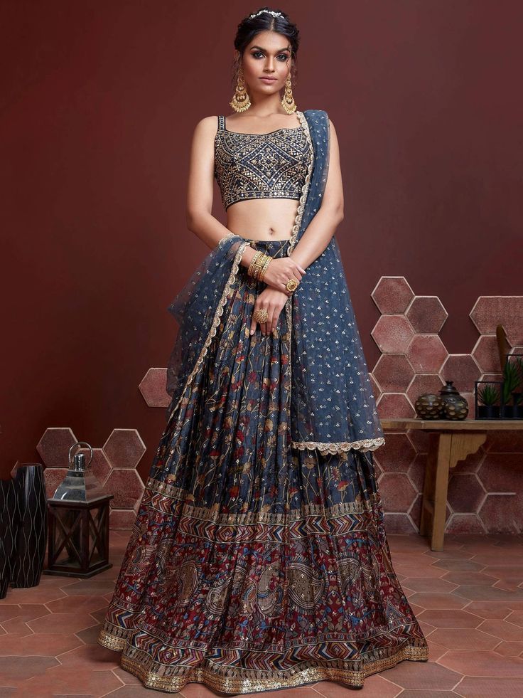 Everyone will admire you when you wear this affair. Add grace and charm to your appearance in this blue color digital print Chinon silk material lehenga beautified heavy embroidery work. Comes with similar color banglori silk sleeveless choli beautified real mirror and heavy embroidery work and heavy soft net dupatta. This digital print blue color silk lehenga is semi-stitched and can be customized in up to 42 sizes. price:- ₹3,999.00 Elaborate Embroidery, Blouse Lehenga, Mirror Work Lehenga, Sabyasachi Lehenga, Indian Lehenga Choli, Party Wear Lehenga Choli, Bollywood Lehenga, Blue Lehenga, Indian Party Wear