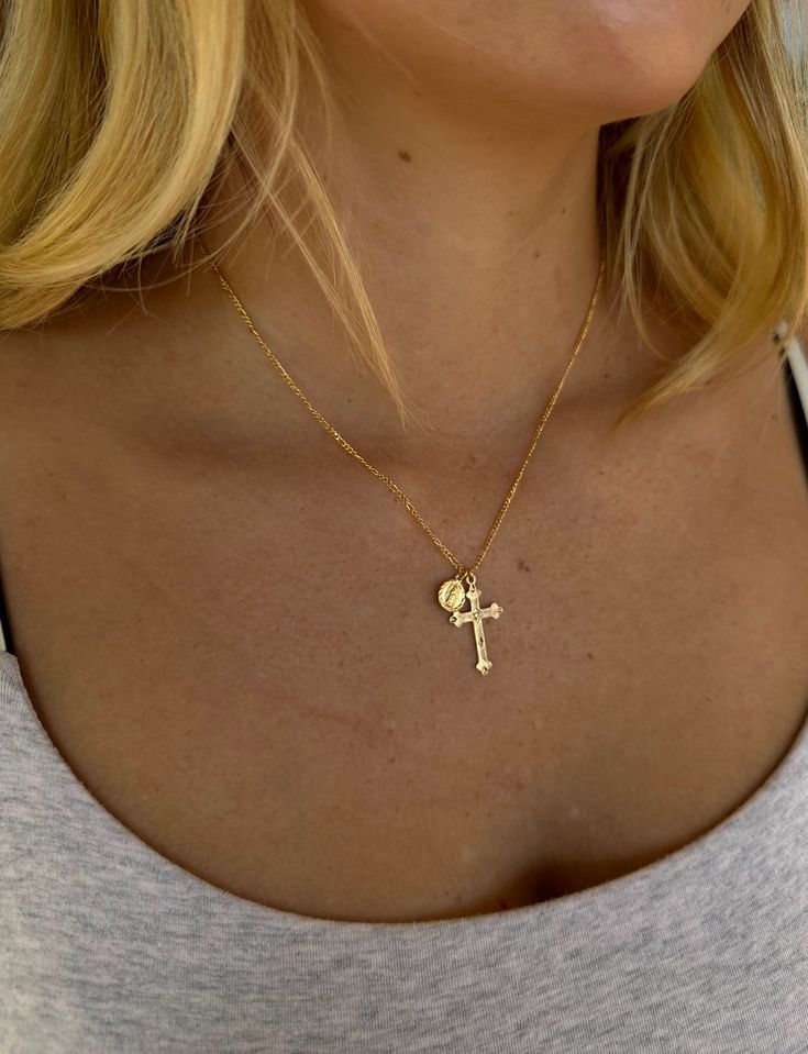 Our Almighty Miraculous Medal Cross Necklace is a reminder of God’s promises. This is the perfect light-weight necklace to elevate your entire look. Product Details: 18K Gold-Filled Figaro Chain 1" 14k Gold-Filled Dainty Cross Charm 5mm 14k Gold-Filled Dainty Mother Mary Charm 16", 18", 20" Lengths Available Water-Wearable Made in Scottsdale, AZ Click here to buy an extender Model Specs: Model is wearing 18" Almighty in the on-body shot Gold Crucifix Necklace, Miraculous Medal Necklace, Dainty Cross Necklace, Cross Necklace Women, Cross Jewelry Necklace, Crucifix Necklace, Christian Necklace, Gold Cross Necklace, Dope Jewelry