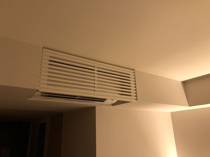 an air conditioner is mounted on the ceiling