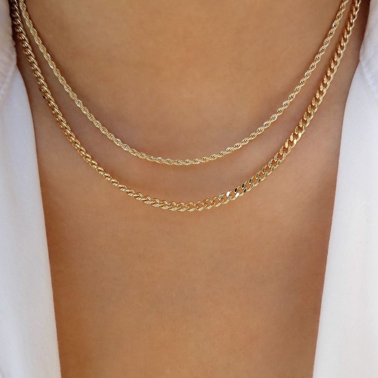 Attached layers, includes everything pictured Material: gold plated brass Length: 14"+ 2" extension IMPORTED Gold Double Strand Figaro Chain Necklace, Gold Curb Chain Jewelry For Layering, Gold Charm Necklaces With Figaro Chain For Layering, Gold Charm Necklace With Figaro Chain For Layering, Gold Plated Gold Charm Necklace With Curb Chain, Gold Double Strand Curb Chain Necklace, Adjustable Gold Necklace With Curb Chain, Gold Layered Snake Chain Necklace With Adjustable Chain, Double Strand 14k Gold Filled Layered Necklace