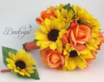 a bouquet of sunflowers and roses on a white background