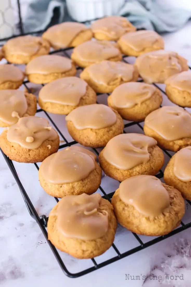 cookies with peanut butter frosting on a cooling rack