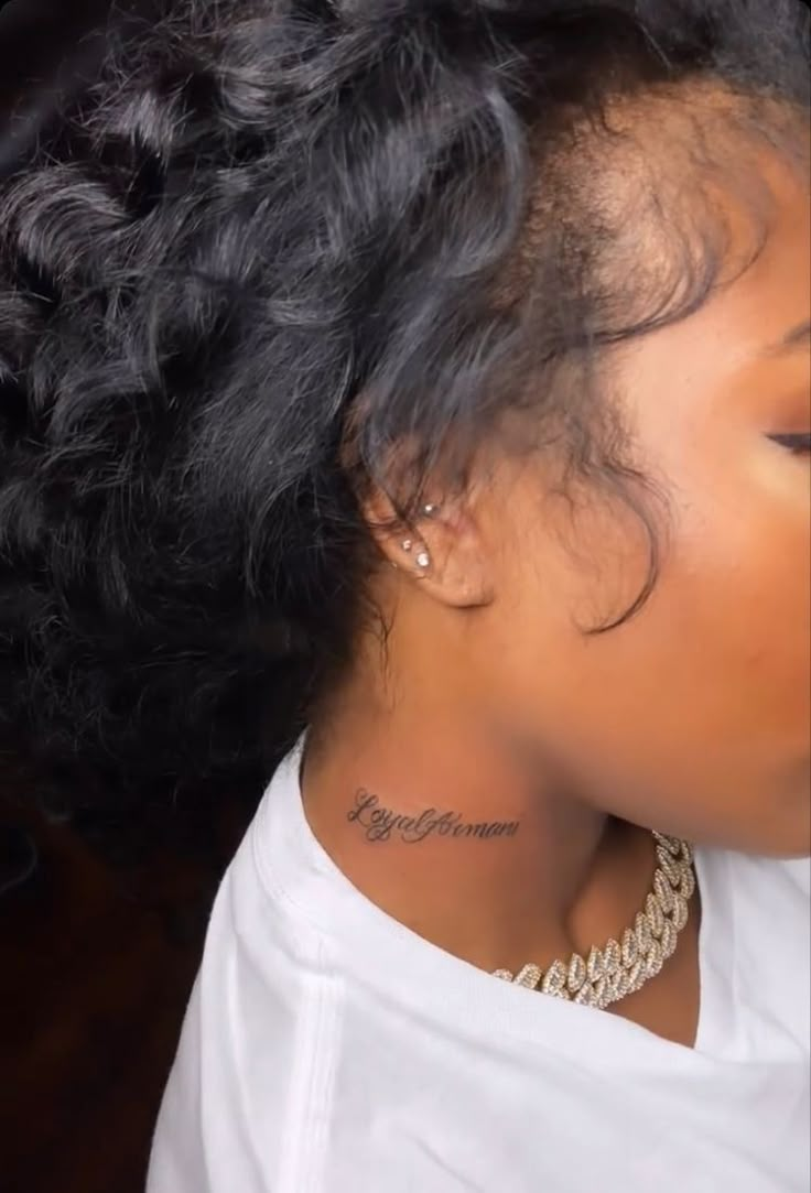 a woman with a tattoo on her neck