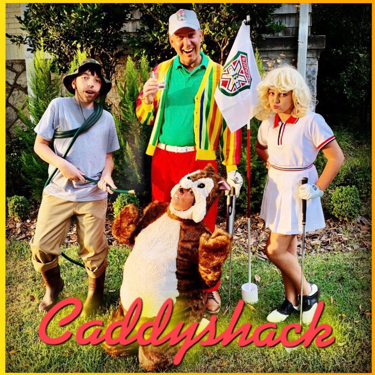 three people in costumes standing next to each other with golf clubs and stuffed animals on their shoulders