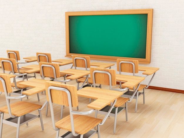 an empty classroom with wooden desks and green chalkboard on the wall, in front of a white brick wall