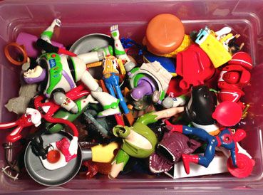 a plastic container filled with lots of toys