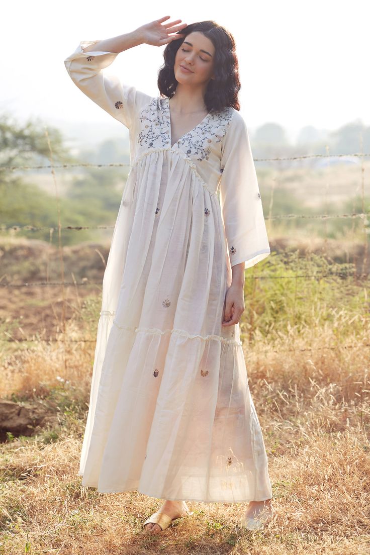 Ivory cotton silk dress with resham and pearls hand embroidery Components: 1 Pattern: Hand embroidered Type Of Work: Resham, Pearls Neckline: V Neck Sleeve Type: Full Fabric: Cotton silk Color: Ivory Other Details:  Closure : Back tie-up Occasion: Work - Aza Fashions Blouse Top Pattern, Frock Models, Womens Blouses Summer, Cotton Silk Dress, Ethereal Dress, Traditional Indian Dress, Cotton Kurti Designs, Kurti Neck Designs, Designer Dresses Casual