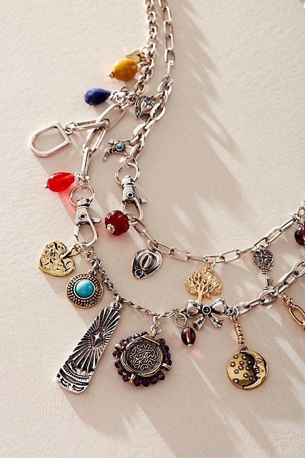 The coolest take on a forever classic, this head-turning charm necklace is featured in a layered design with colorful, vintage-inspired dangle detailing throughout for the perfect collected finish. **Features:** Adjustable fit, chain design, defined dangle detailing **Why We ❤ It:** Just as effortless as it is essential, this so cool charm necklace is sure to be a staple in your weekly wardrobe rotation for countless years to come. | Maxamillion Charm Necklace by Free People in Silver Chunky Silver Jewellery, Free People Necklace, Upcycled Vintage Jewelry, Vintage Assemblage Jewelry, Long Necklace Boho, Talisman Jewelry, Free People Jewelry, Jewelry Accessories Ideas, Assemblage Jewelry