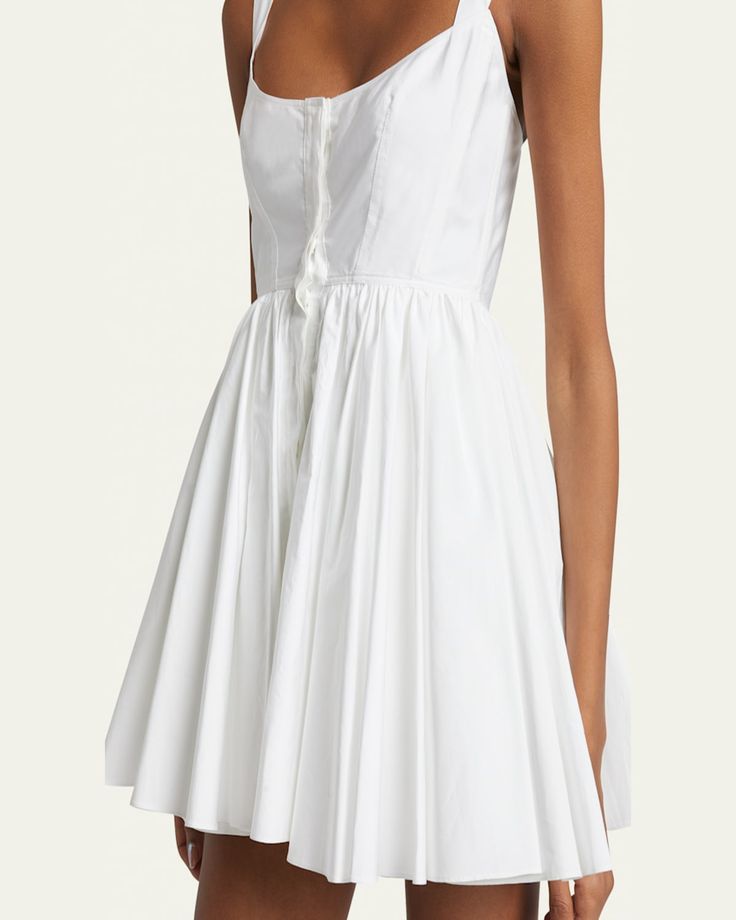 ALAIA skater dress    Scoop neckline    Shoulder straps    Side slip pockets    Mini length    Fit and flare silhouette    Front concealed button placket    Cotton    Made in Italy Mini Skater Dress, Bergdorf Goodman, Skater Dress, Button Placket, Scoop Neckline, Shoulder Straps, Fit And Flare, Tops Designs, In Italy