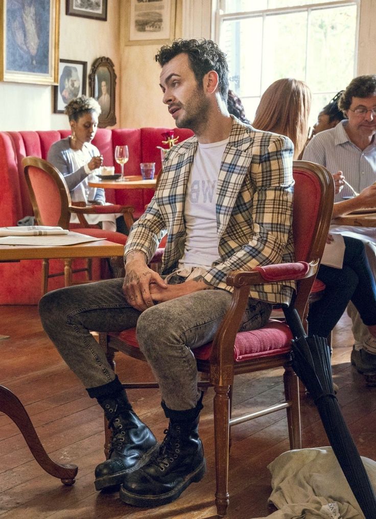 a man sitting in a chair at a restaurant