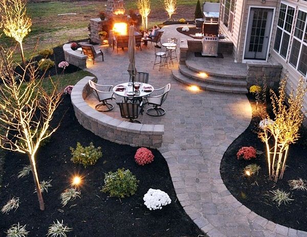 an outdoor patio lit up with lights