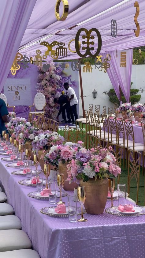 the tables are covered with purple and gold decorations