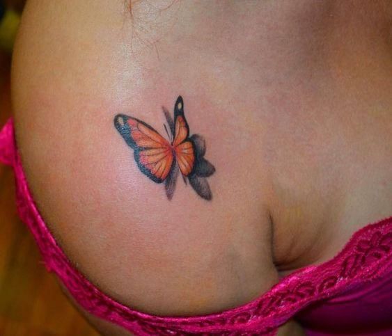 a woman's stomach with a butterfly tattoo on her left side ribcage