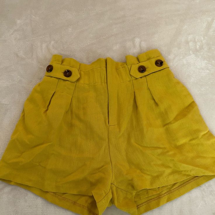 Never Worn Chartreuse Shorts From Anthropologie With An Adjustable Waist And Button Detail. Super Soft Material! Yellow High-waisted Bottoms With Built-in Shorts, Summer Bottoms With Buttons For Vacation, Summer Style Bottoms With Buttons For Vacation, Summer Vacation Bottoms With Buttons, Trendy Yellow Shorts With Pockets, Green Summer Bottoms With Buttons, Chic Yellow Shorts With Built-in Lining, Chic Yellow Shorts With Built-in Shorts, Summer Bottoms With Button Closure For Vacation