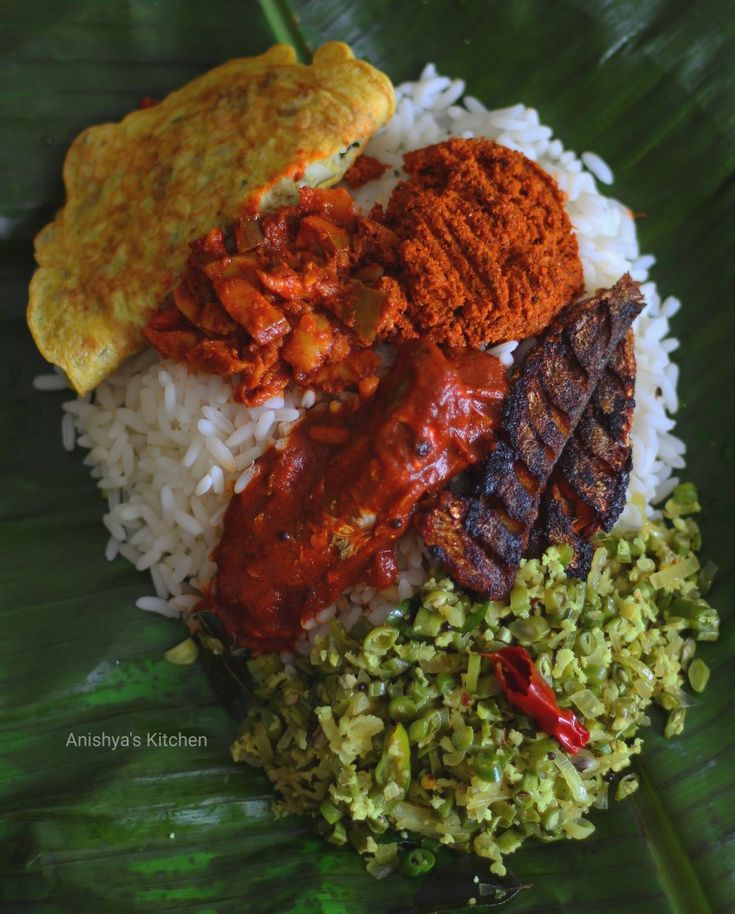 the meal is prepared and ready to be eaten on the big leafy platter