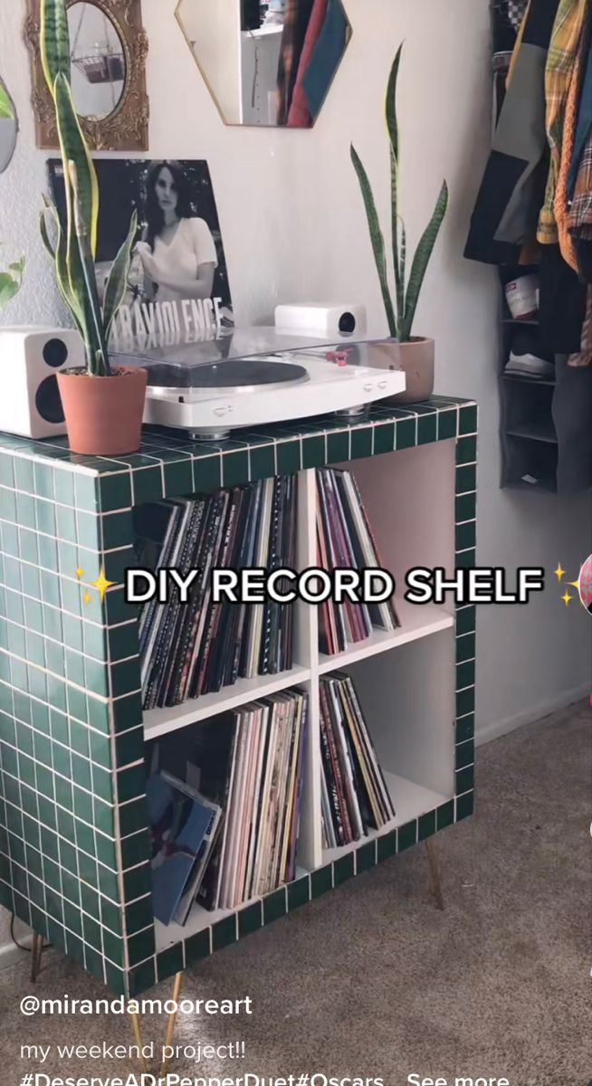 a record shelf with records on it in a room