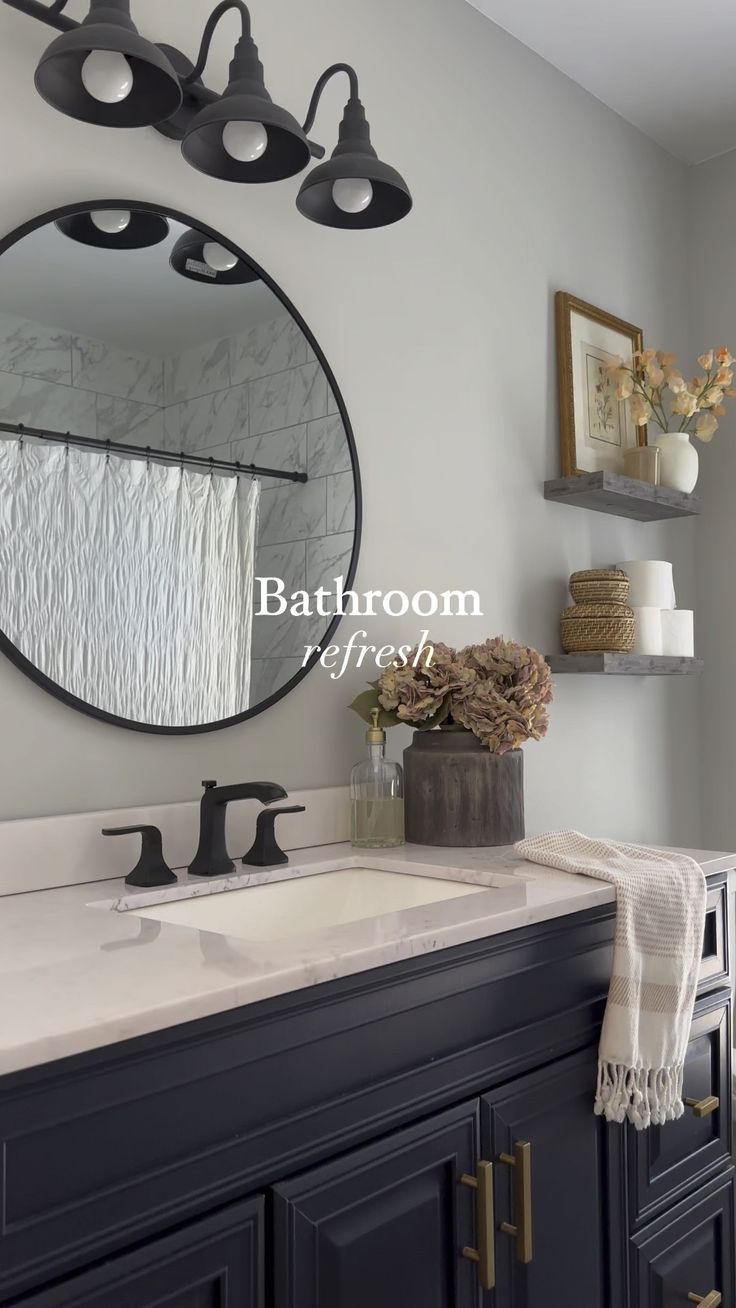 a bathroom with a sink, mirror and towel rack