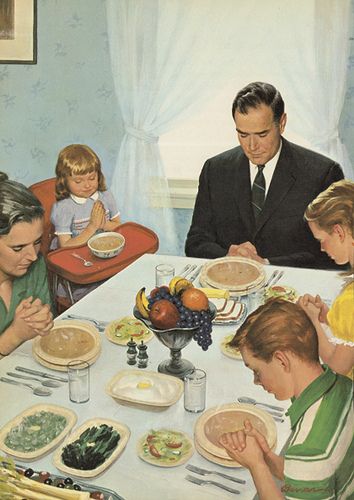 a family sitting around a table eating food