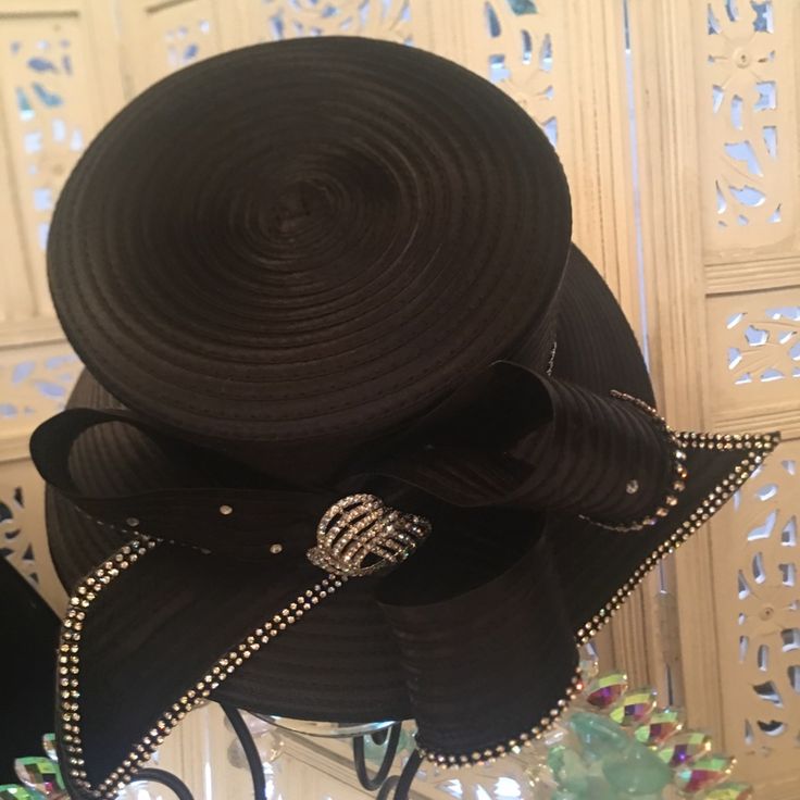 Perfect For Any Occasion, Especially Opening Day At The Races. Classy And Elegant. 100% Polyester. The Special Details Of The Rhinestones And The Ribbon Like Design Make It A Must Have In Your Hat Collection. It Can Be Adjusted To Your Size. Elegant Evening Hats With Rhinestones, Black Evening Hat With Rhinestones, Black Evening Hats With Rhinestones, Black Hat With Rhinestones For Evening, Elegant Black Hats With Rhinestones, Elegant Black Adjustable Hat, Elegant Bedazzled Hats, Adjustable Black Hats With Rhinestones, Adjustable Black Hat With Rhinestones