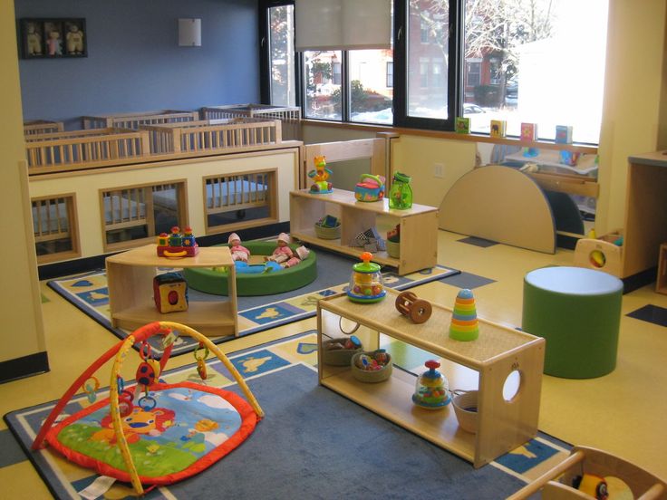 a child's play room with toys and furniture