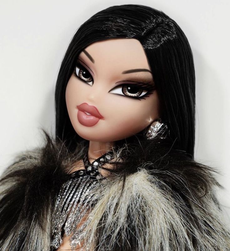 a close up of a doll with black hair