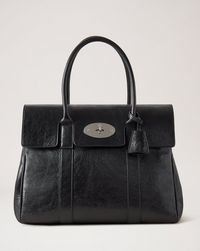 The Bayswater is a true Mulberry icon. A timeless and classic shoulder bag, it unites the very best of Mulberry’s craft heritage and effortless style. It celebrates the exceptional level of our leather quality, and is proudly finished with the signature Postman’s Lock. Bayswater Tote, Mulberry Shoulder Bag, Mulberry Bush, Mulberry Bayswater, Mulberry Bag, Bag Icon, Purse Accessories, Leather Care, Black Tote Bag