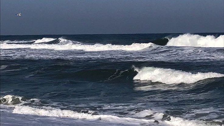 two surfers are riding the waves in the ocean