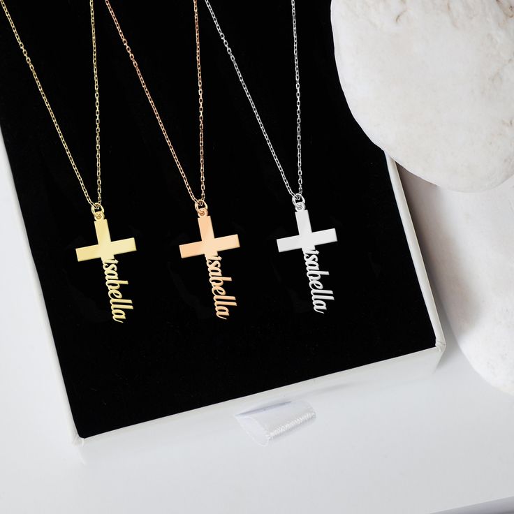 "Discover the elegance of our 14K Solid Gold Cross Necklace, thoughtfully designed to add a personalized touch. Through its unique craftsmanship, your precious name takes a graceful position at the cross's pinnacle. As a Tiny Cross Necklace, it emerges as a heartfelt gift, echoing sentiments of love, devotion, and individual essence. PRODUCT DETAILS * Material: 14K Solid Gold (real solid gold, no gold-filled or no gold plated material) * Choice of Gold Color: Yellow Gold, Rose Gold, White Gold * Closure: Spring ring * Chain style: Cable * Style: Minimalist Thinking of gifting? Elevate your order with our Christmas Gift Wrap option! 🎁 Buy from here! https://www.etsy.com/listing/1580219719/ M O R E F R O M U S Mionza Jewels' pieces are handcrafted by 30 years of experienced craftsmen and ma Location Names, 14k Gold Initial Necklace, Necklace With Name, Tiny Cross Necklace, Personalized Cross Necklace, Tiny Cross, Personalized Cross, Custom Cross, Necklace Cross