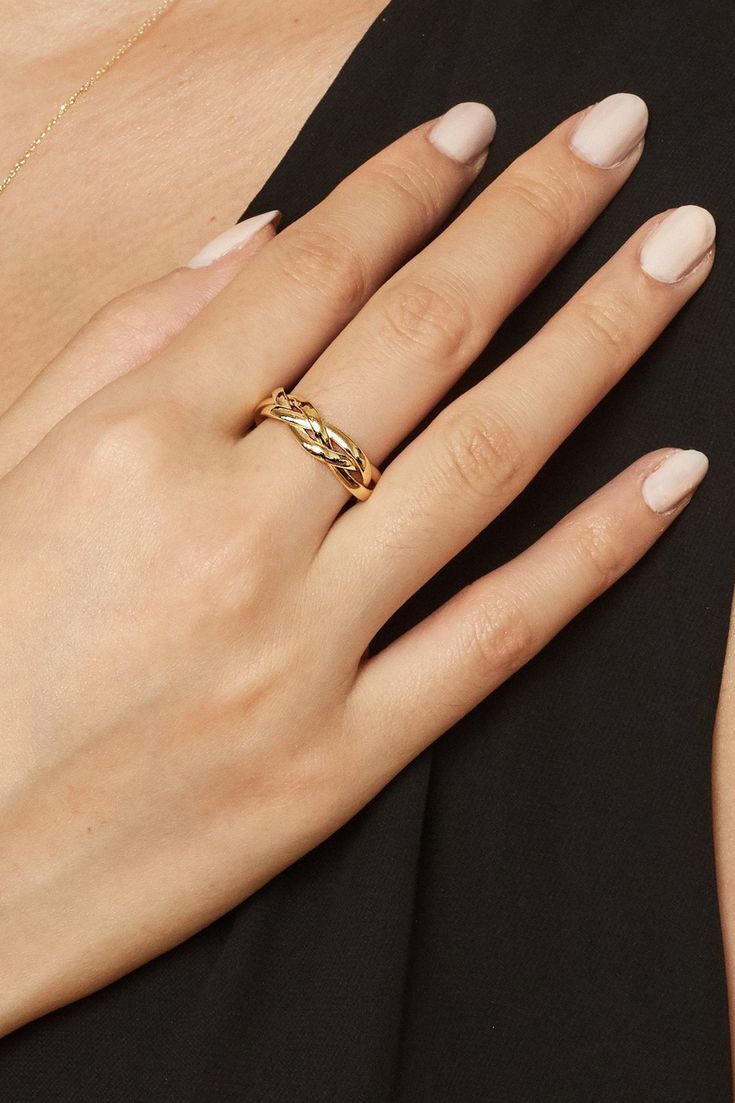 A thick gold braid gives this ring its soft, romantic feel. Eye catching in both design and shine, our Amore Braided Ring makes a statement by itself or stacked with other favorites. Metal: 14 Karat Yellow Gold Dimensions: 5.3mm Width Weight: 1.7 Grams Construction: Tubing Origin: Crafted in Arezzo, Italy Gold Twisted Promise Ring, Twisted Gold Anniversary Rings, Elegant 14k Gold Twisted Ring, Elegant Twisted Promise Rings, Twisted Yellow Gold Wedding Rings, Elegant Twisted Wedding Ring, Elegant Twisted Anniversary Rings, Thick Gold Ring, Ribbon Ring